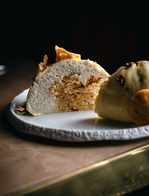 Dessert cut in half, revealing its delicious texture, served at Dans le Noir?